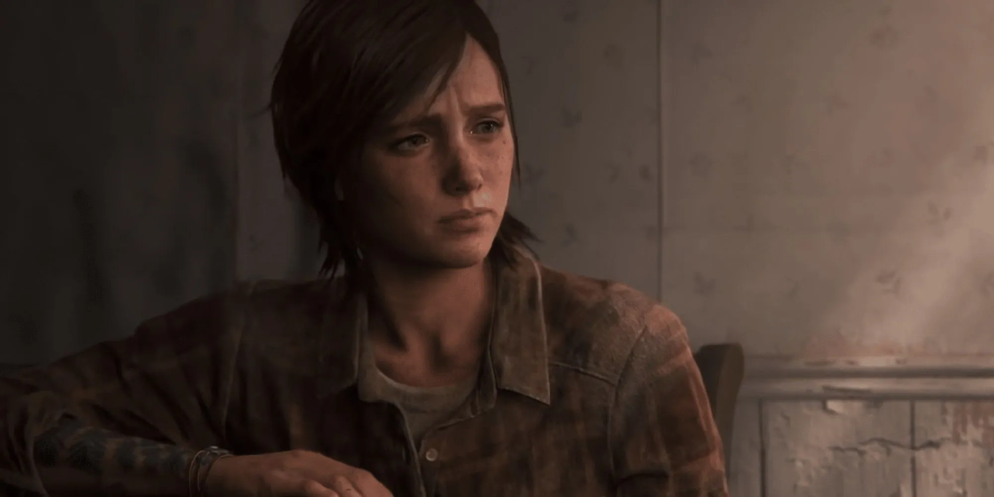 Ellie ngồi một mình trong căn nhà bỏ hoang ở cuối The Last of Us Part 2