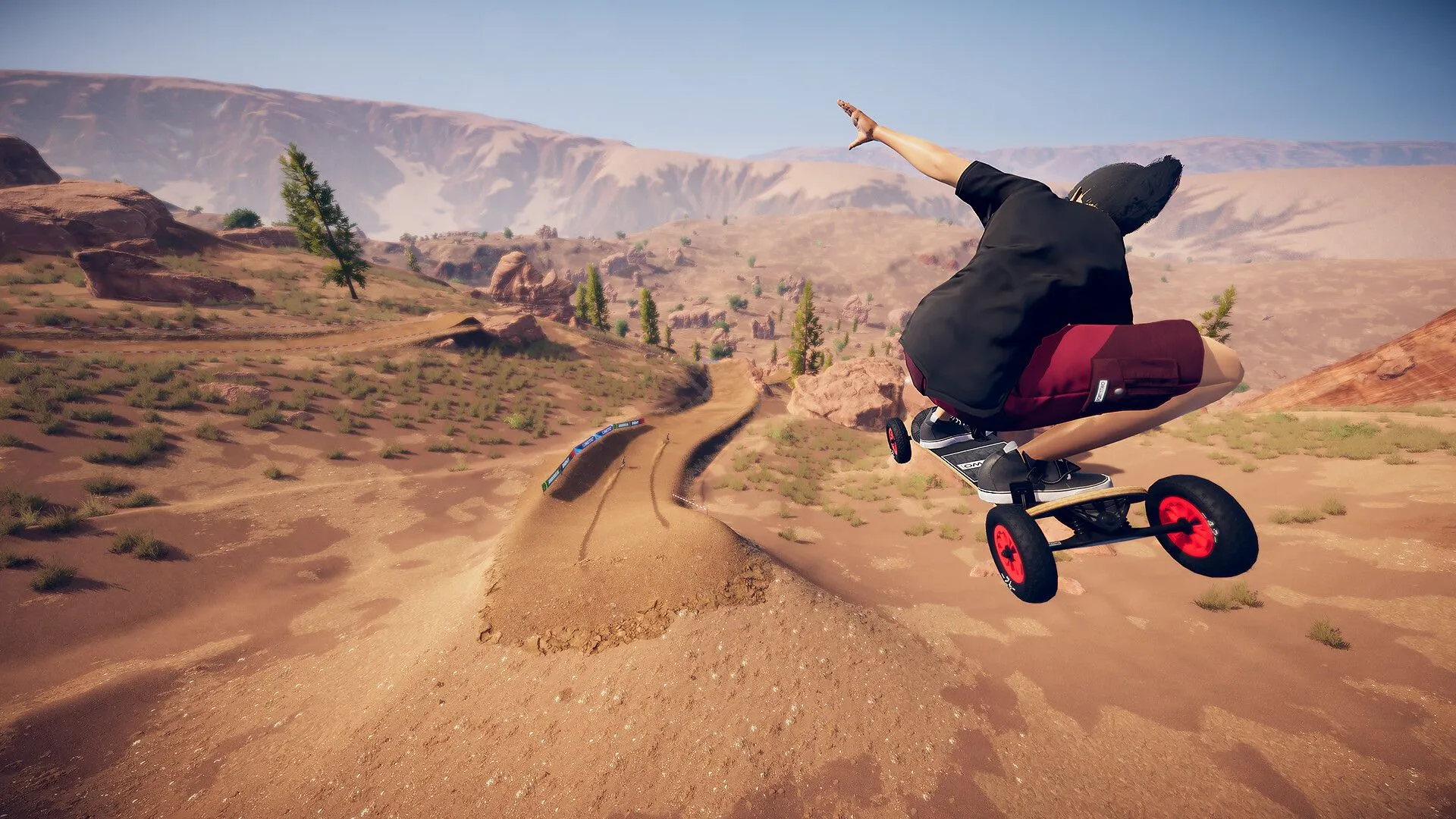 Hình ảnh trong game Descenders Next với một tay đua xe đạp địa hình đang thực hiện cú nhảy mạo hiểm trên cung đường núi.