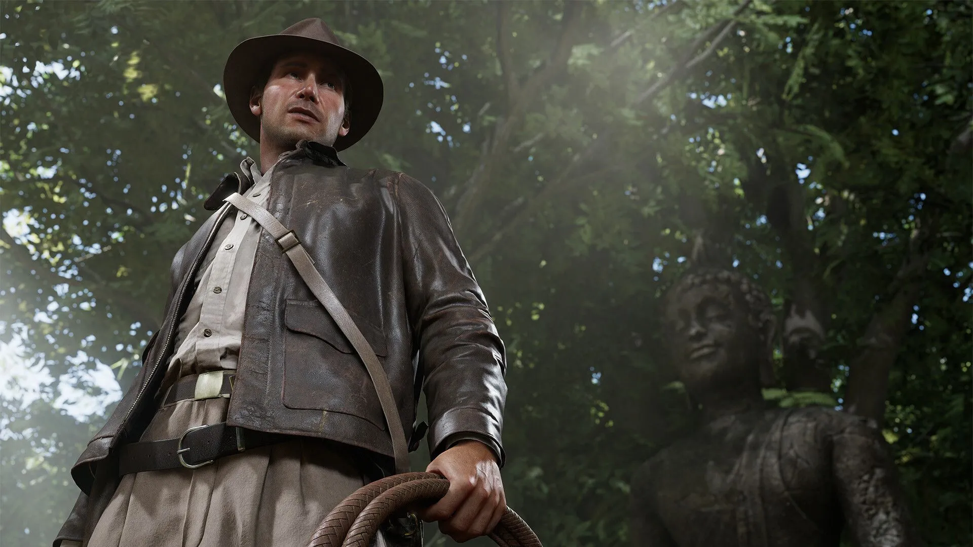 Indiana Jones đang khám phá một hang động tối trong The Great Circle