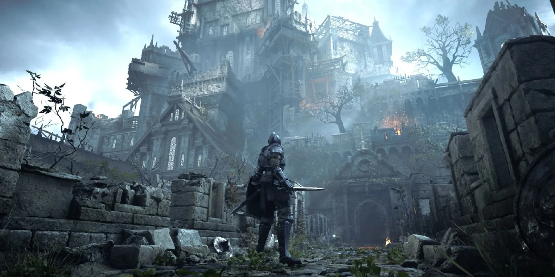 Khung cảnh hùng vĩ của lâu đài Boletaria trong Demon's Souls Remake dưới bầu trời u ám