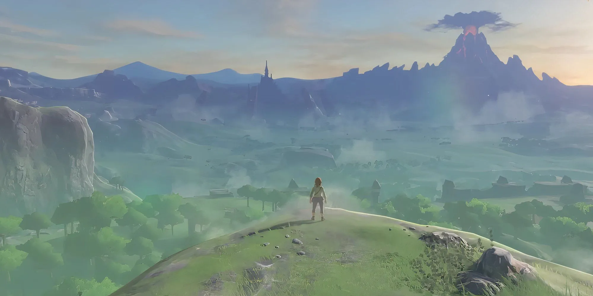 Link đứng trên vách đá nhìn ra Hyrule rộng lớn trong The Legend of Zelda: Breath of the Wild