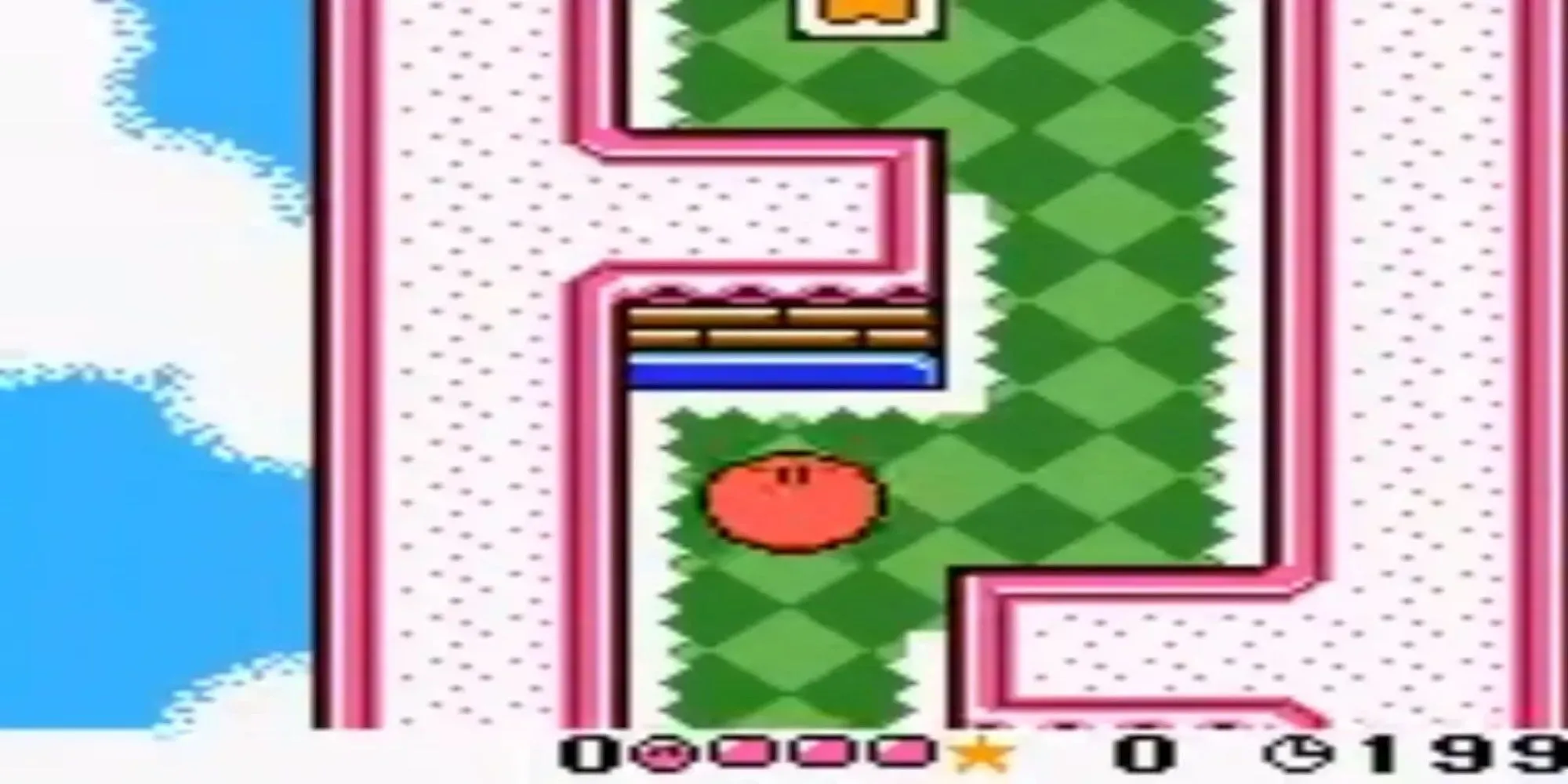 Nhân vật Kirby màu hồng đang lăn trên một màn chơi đầy màu sắc trong Kirby Tilt 'n' Tumble