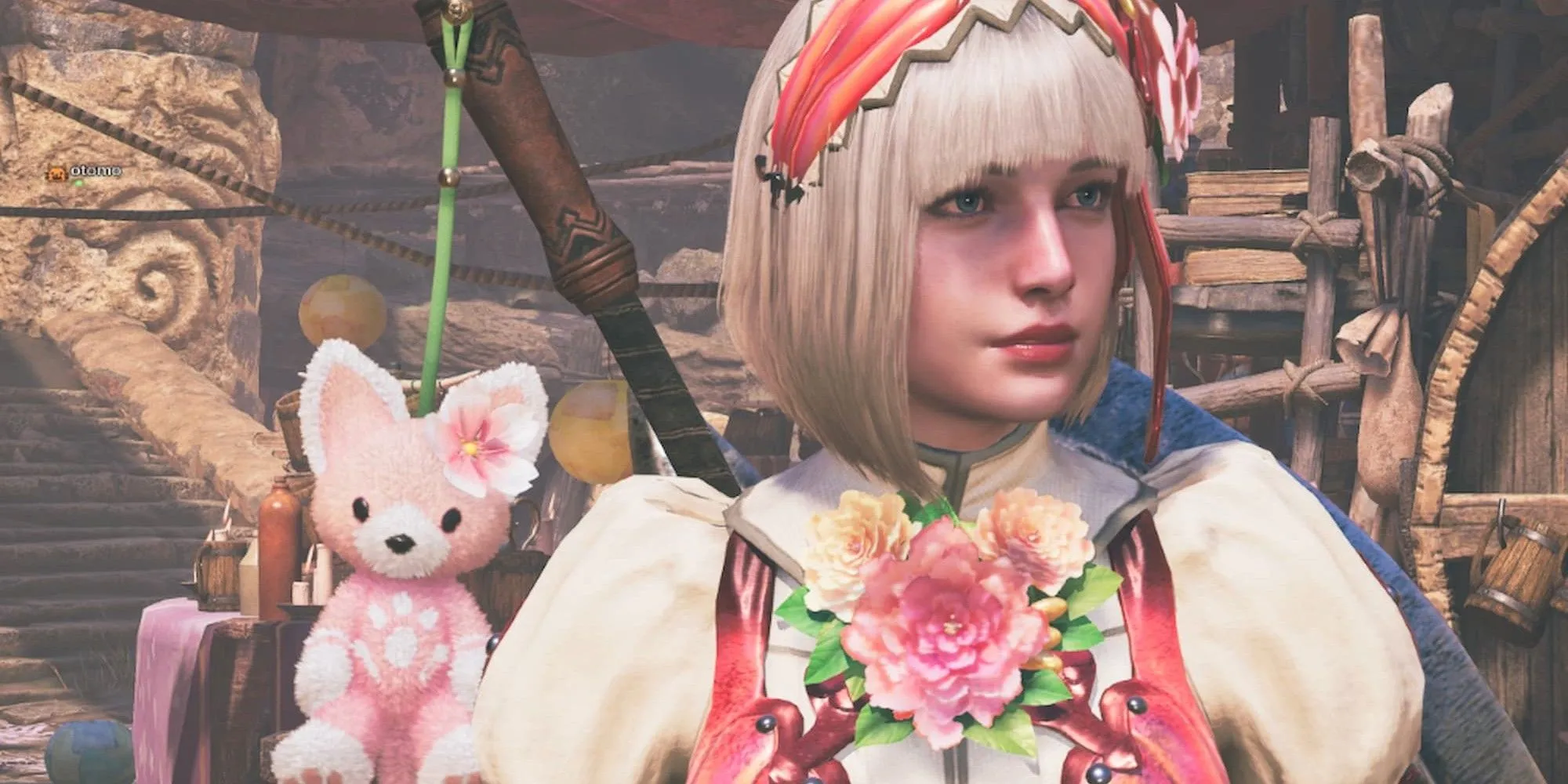 Nhân vật nữ thợ săn và thú nhồi bông trong Monster Hunter Wilds, liên quan đến các thành tựu chung