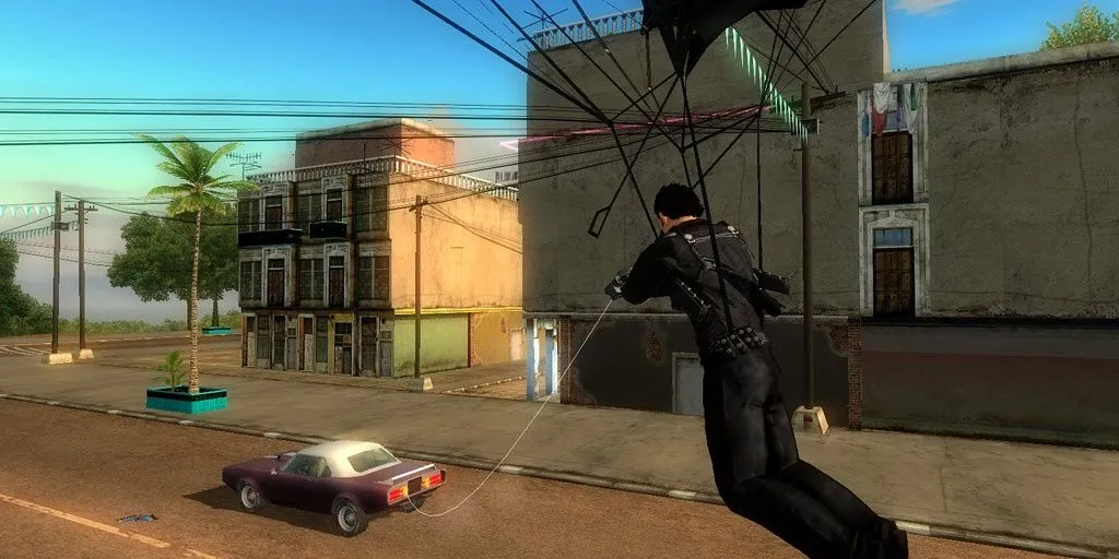Nhân vật Rico đu dù bám theo một chiếc xe hơi trong game Just Cause