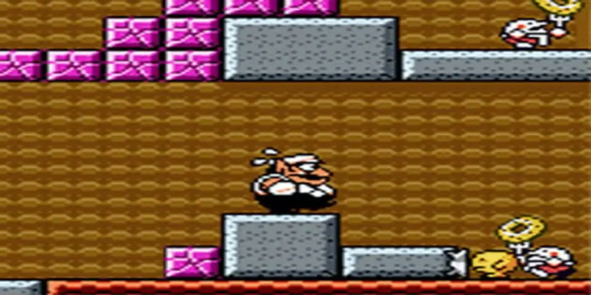 Nhân vật Wario đang thực hiện một hành động đặc biệt trong Wario Land 3 trên Game Boy Color