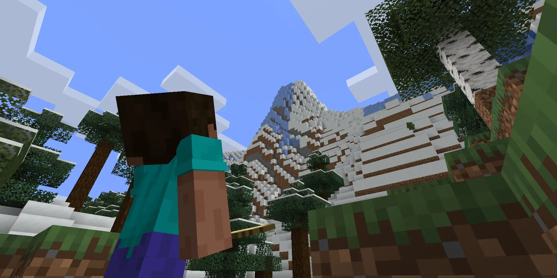 Steve đứng nhìn vách núi khổng lồ sau cập nhật Caves & Cliffs trong Minecraft
