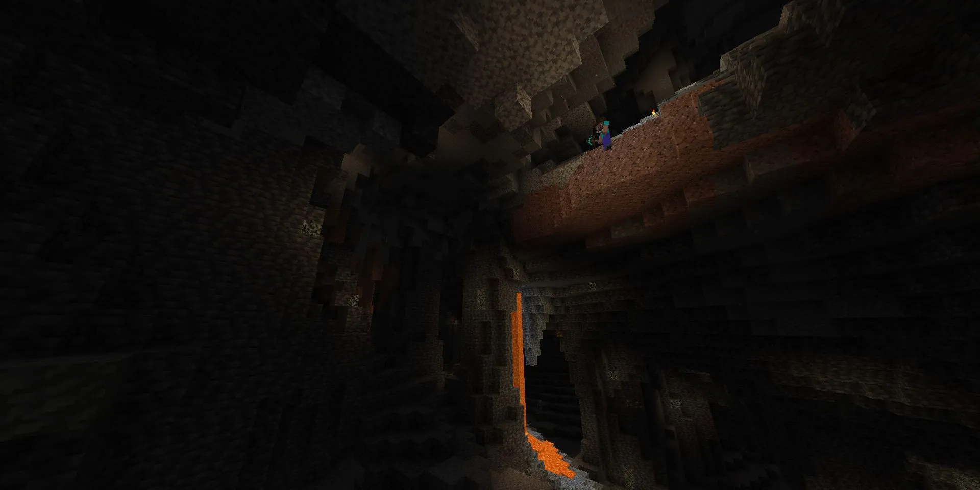 Steve đứng trên rìa vách đá nhìn xuống hang động lớn trong Minecraft
