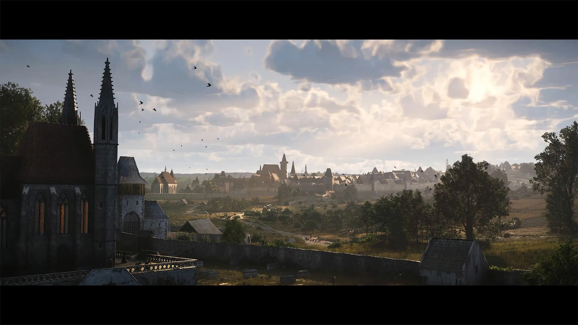 Một cảnh quan làng mạc yên bình giữa thiên nhiên trong Kingdom Come: Deliverance II, thể hiện thế giới sống động và chân thực của game