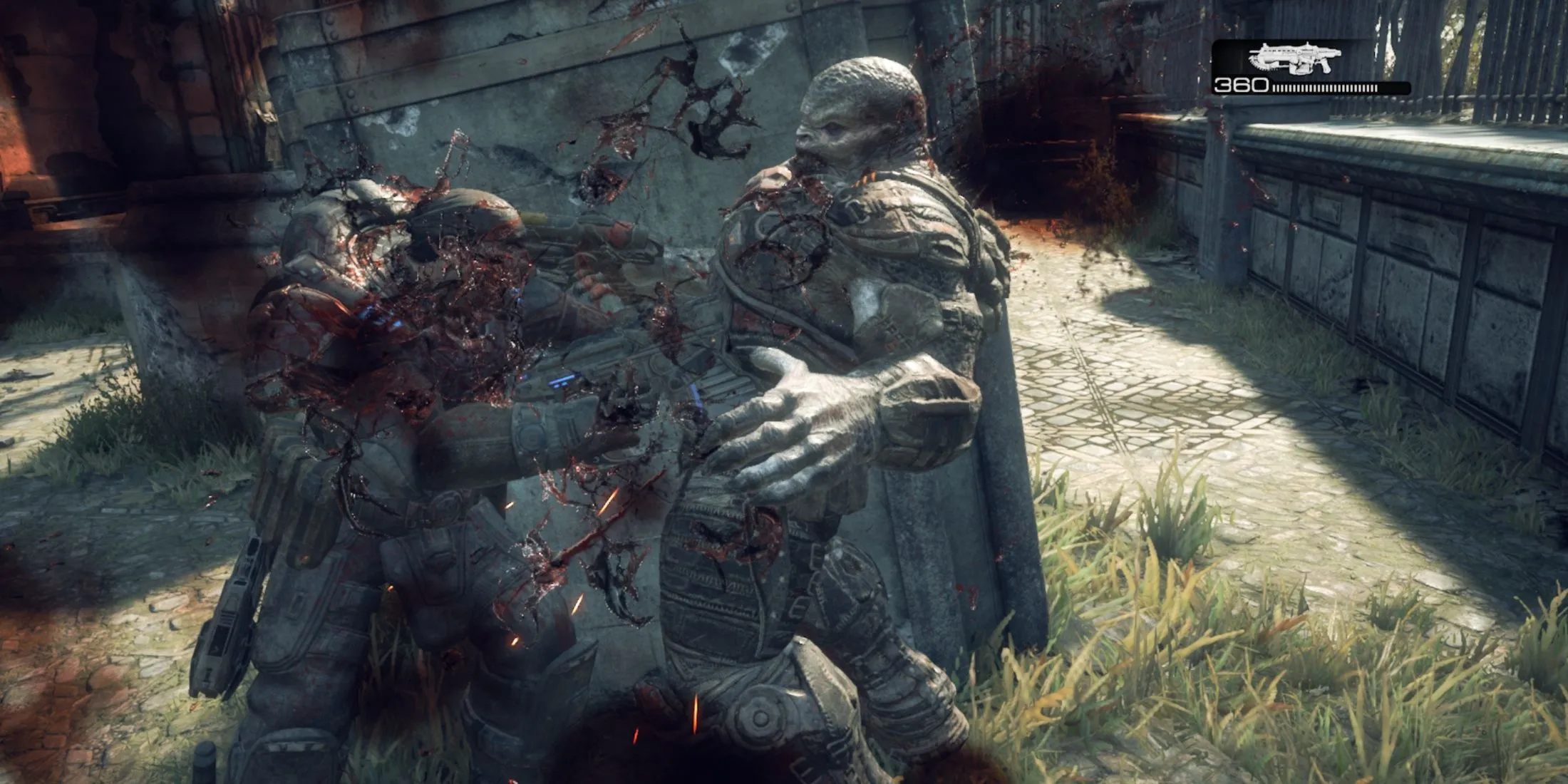 Cảnh tượng một binh sĩ COG dùng cưa máy Gnasher hạ gục Locust trong Gears of War Reloaded đầy kịch tính